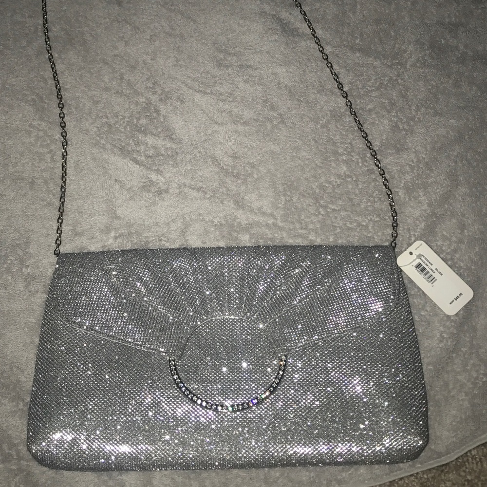 Never used sparkly silver cross body purse.
